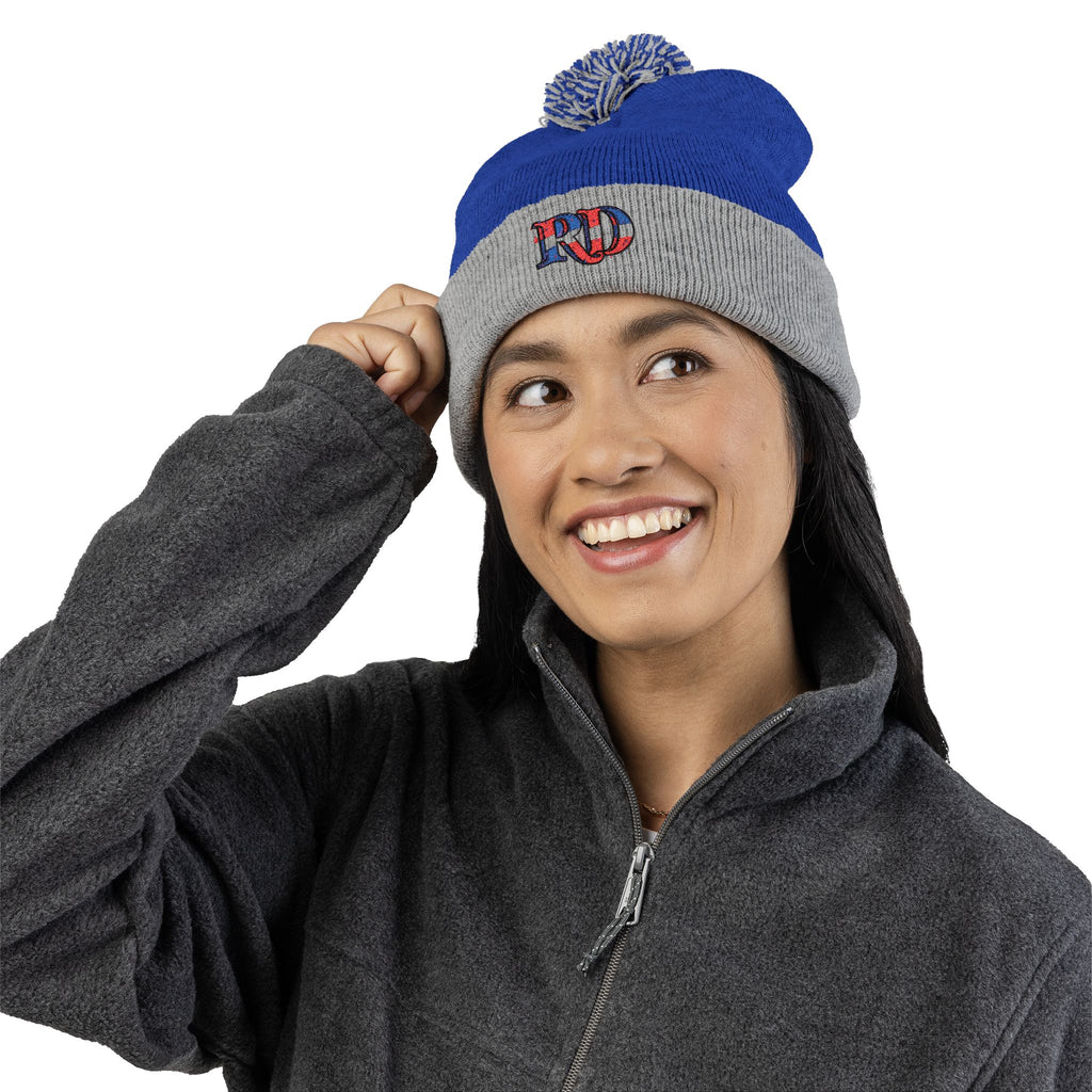 Knitted hat with the letters RD for Dominican Republic and pom-pom embroidery: the perfect winter accessory.