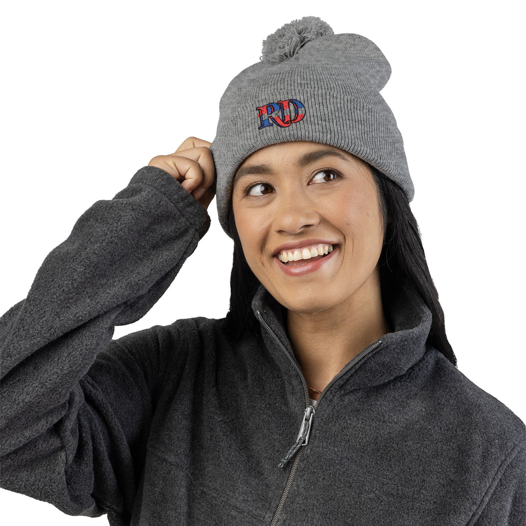 Knitted hat with the letters RD for Dominican Republic and pom-pom embroidery: the perfect winter accessory.